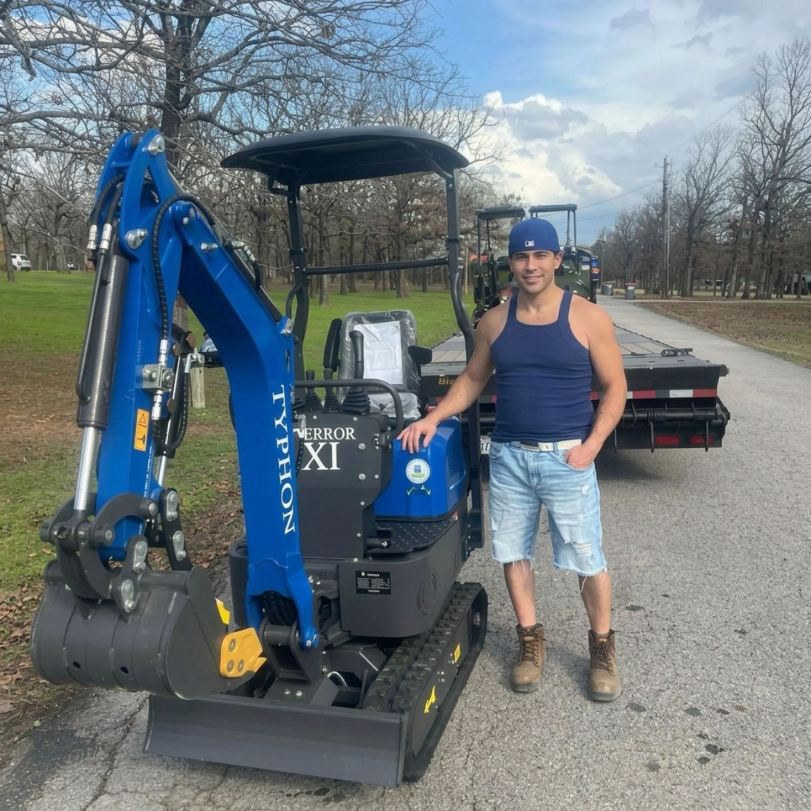 Customer receiving a TYPHON TERROR XI mini excavator delivery